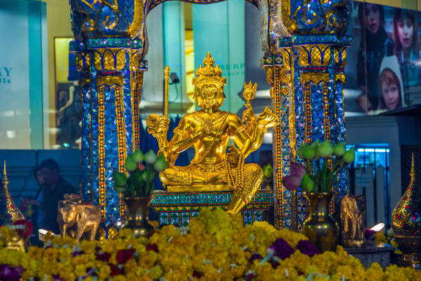 Bangkok, Thailand - December 22, 2009: people at famous Erawan shrine in Bangkok, Thailand. The shrine was the goal of a bomb assassination in AUG 2015.