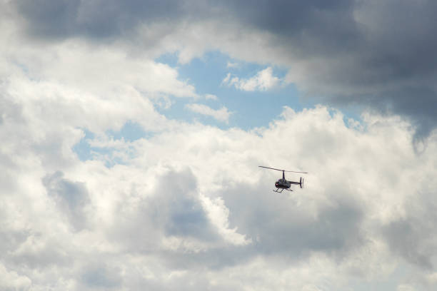 istock Clouds in the sky are crossed by a helicopter. 1357269196