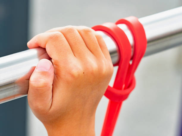 istock Woman`s hands stretching an exercise rubber band 1357272345