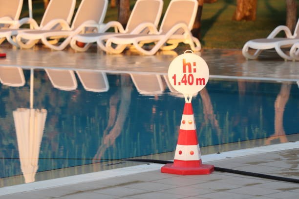 istock Warning sign indicator of swimming depth in the pool 1357272682