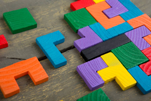 istock Creative solution for idea - business concept, jigsaw puzzle on the wooden desk 1357273750