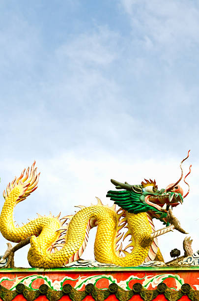 istock Golden dragons on the chinese temple with blue sky 135727530