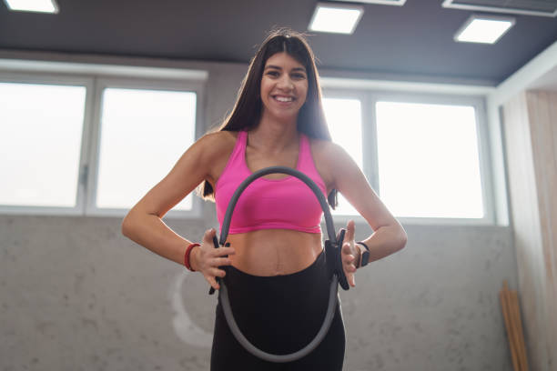 istock Pregnant woman pilates exercise magic ring with fitball 1357276871