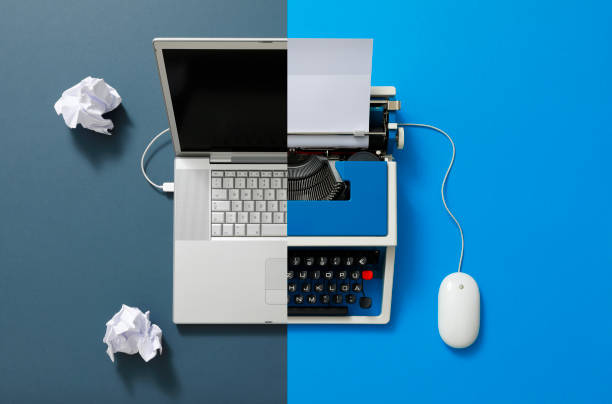 istock Digital und analog – Laptop and 80s Typewriter 1357278991