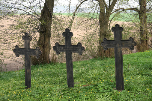 Three Crosses standing on an old cemetery on the R