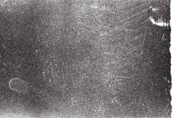 Blank grained film strip texture background with heavy grain and dust