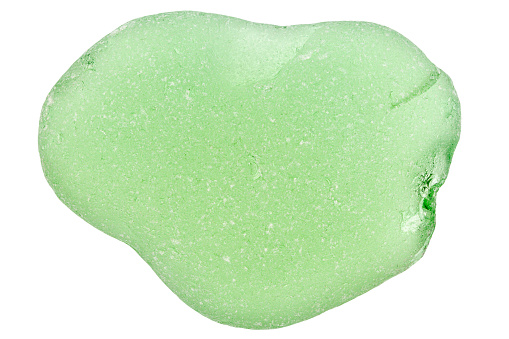 Piece of green sea glass isolated on white background