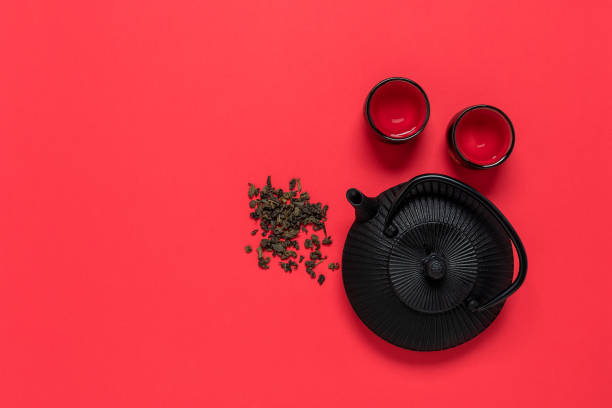 https://media.istockphoto.com/id/1357284282/photo/black-metal-teapot-and-cups-for-tea-on-a-red-textured-background-view-from-above-asian-tea.jpg?s=612x612&w=0&k=20&c=5Qe4t9wk8L0iGliebSExCsckNYRWzcARkctA-t0uWgQ=