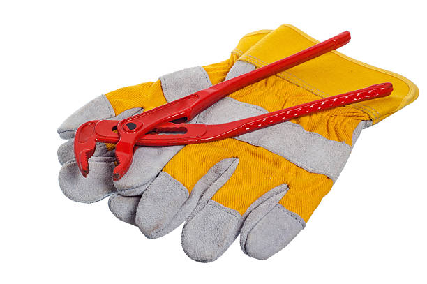 istock Working gloves and wrenches isolated on white 135728482