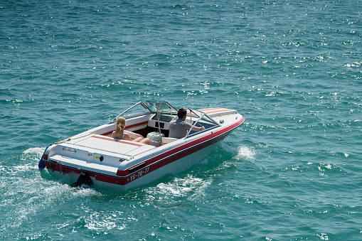 Krk, Croatia – August 08, 2021: Motor boat on the Adriatic Sea near the town of Krk on the island of the same name in Croatia