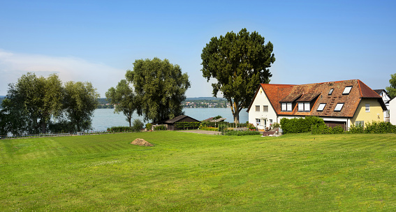 Niederzell, Germany, July 3, 2015: View of a house on the island Reichenau on the shore of the Lake Constance (German: Bodensee). Reichenau is listed as UNESCO World Heritage Site.