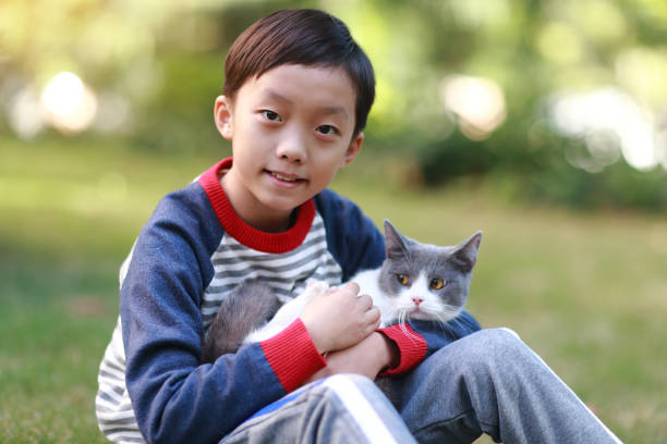 istock Little boy and his cat 1357290037