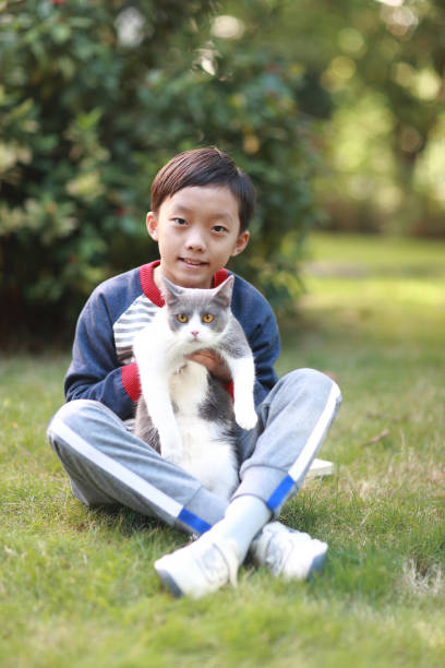 istock Little boy and his cat 1357290039