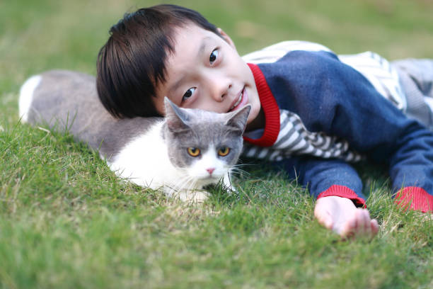 istock Little boy and his cat 1357290085