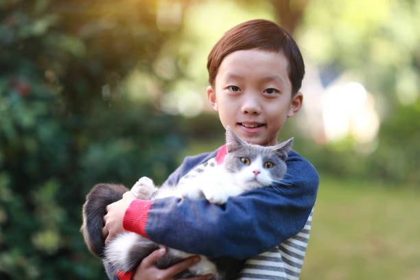 istock Little boy and his cat 1357290096