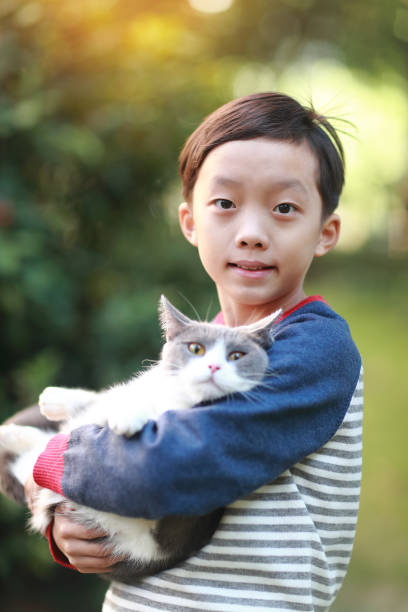istock Little boy and his cat 1357290106