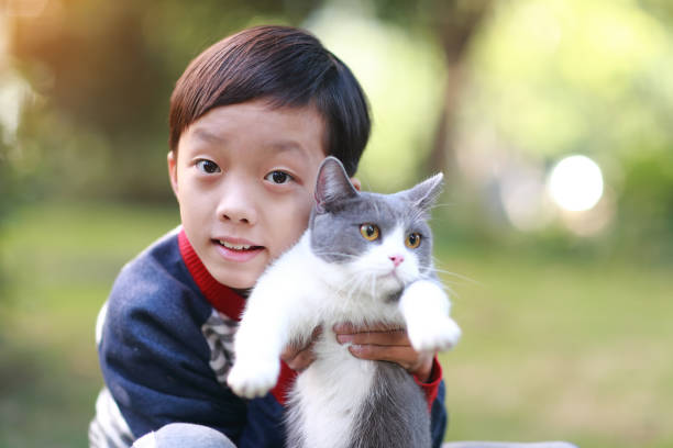 istock Little boy and his cat 1357290176