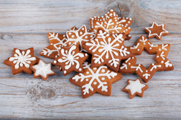 istock Gingerbread Christmas Star Cookies on white rustic wooden table 1357290618