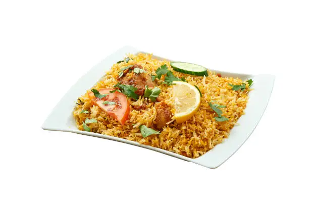 Overhead  shot of Chicken Biryani on white plate. Isolated on white with clipping path