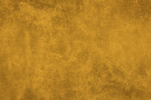 Beautiful gold background with genuine leather texture