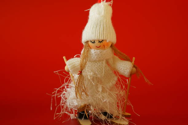 istock Christmas angel on skis close-up. 1357293768