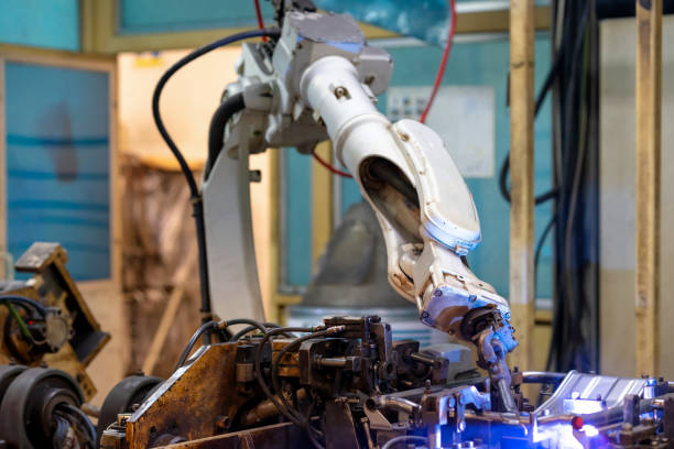 istock Welding robot in automotive plant 1357294144