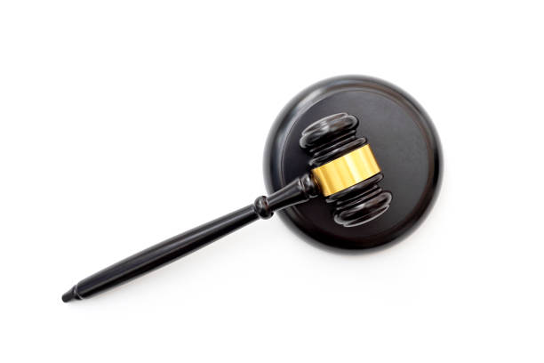 Broken wooden judge gavel isolated on white background. Concept of iniquity, injustice and lawlessness.