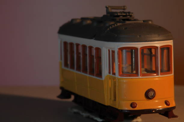 istock Old yellow Lisbon toy tram, isolated 1357303514