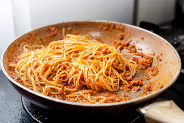 istock Cooking bolognese spaghetti pasta at home 1357304379