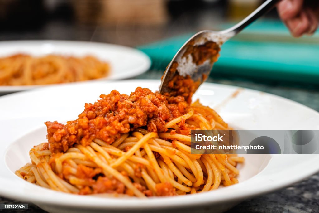 Chef plating pasta spaghetti dish Pasta Stock Photo