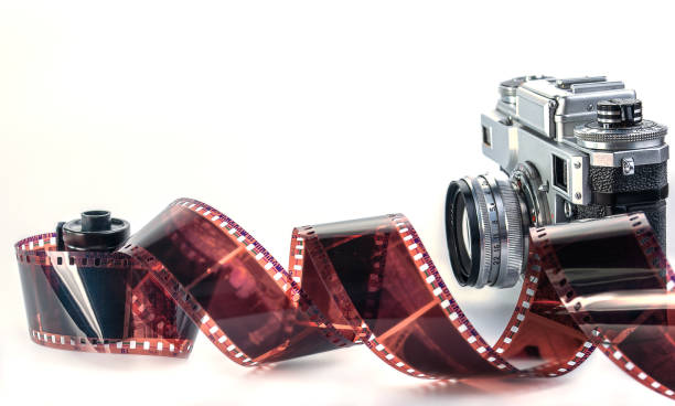 istock still life with retro analog camera, camera roll and cassettes on white background with copy space 1357305512