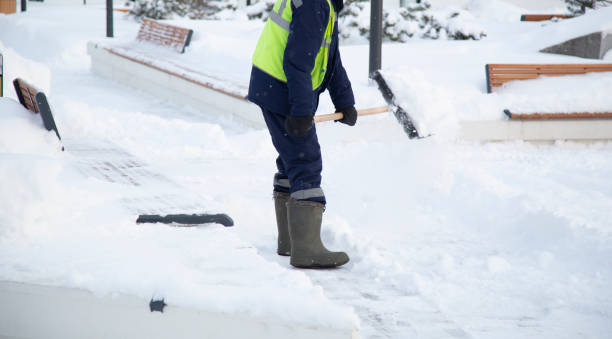 istock Snow removal by an employee of communal services. 1357310104