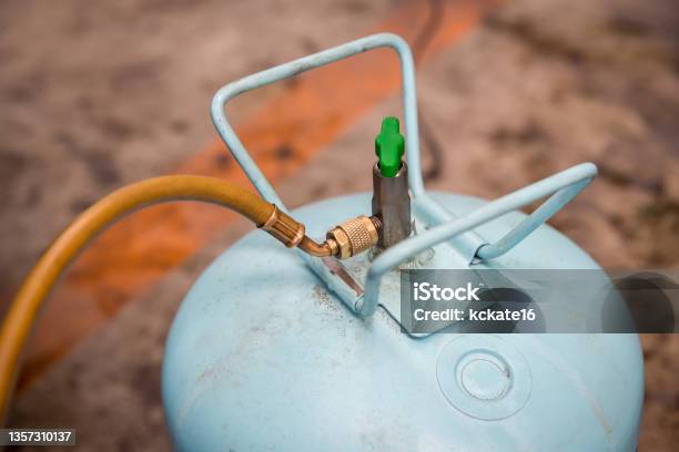 Coupler Contains R134a Adapter For Refrigerant Fill The Infusion Tank Refrigerant Gas Cylinder Hose Servicing Car Air Conditioner Stock Photo - Download Image Now