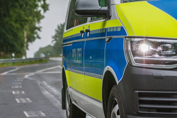istock Police car from the side with front headlights 1357312773