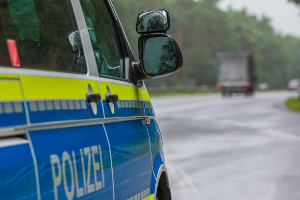 istock Police cars from the side with wing mirrors 1357312792