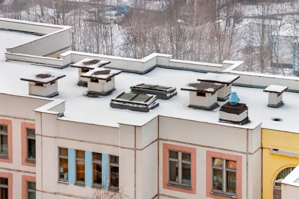 Aerial view winter flat roof of the kindergarten in residential district area