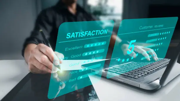 Photo of The concept of a customer satisfaction survey.Versual screen, business people or customers express their happiness. By awarding the highest level of satisfaction and five stars.