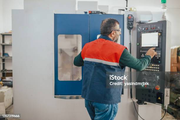 Senior Man Working On Cnc Machine Stock Photo - Download Image Now - CNC Machine, Machining, Lathe