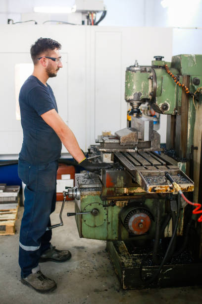 istock young worker working in industrial shop. 
may 1 labor day 1357319953