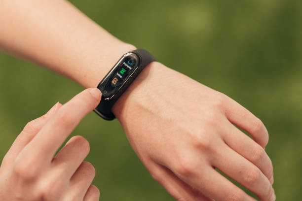 istock Girl Tapping On Smart Watch After Gymnastic Exercises 1357320718