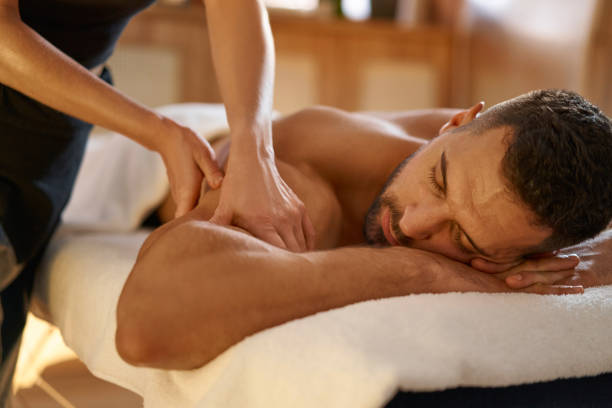 istock Relaxed man enjoying massage in spa 1357320828