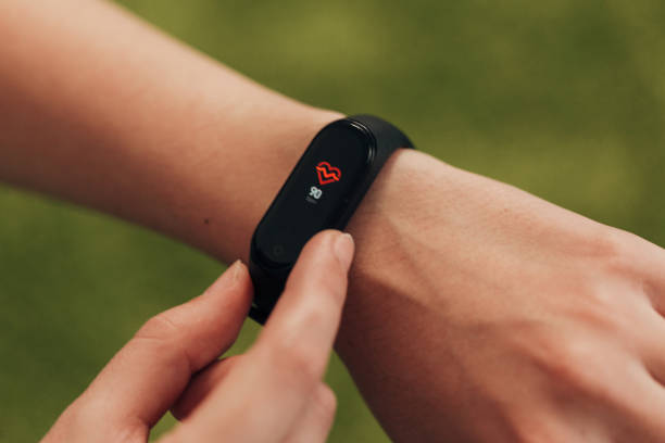 istock Girl Checking Her Heart Rate On Smart Watch 1357320886