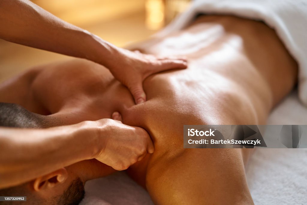 Close-up of a man getting  massage Massaging Stock Photo