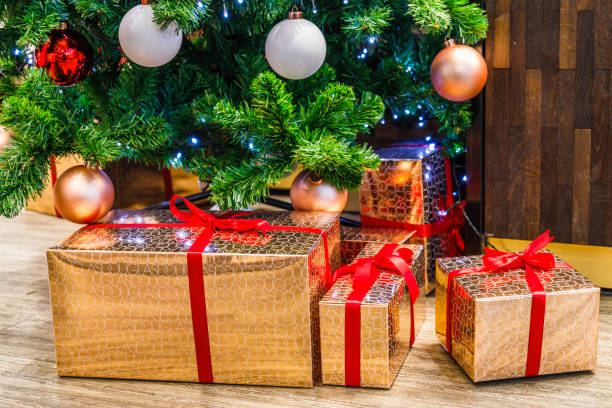 istock Christmas decoration with gift boxes under the fir tree 1357322232
