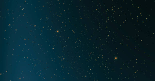 istock golden yellow shiny moving blurred bokeh particles, sparkles on blue background. Blurry, defocused, shiny patterns. mixing mode 1357322287