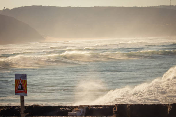 Big breaking Ocean waves hit the coastline. Strong wave