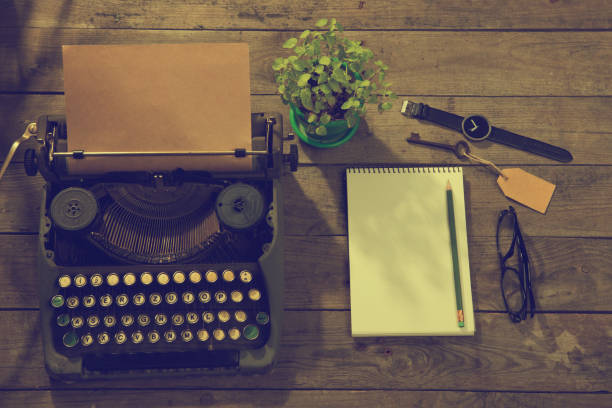 istock Vintage typewriter on the old wooden desk 1357329044