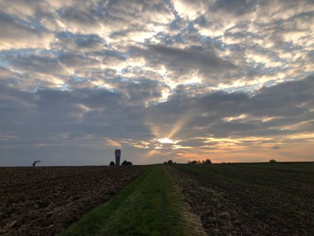 istock Sunbeams blink through the gaps in the clouds 1357330563