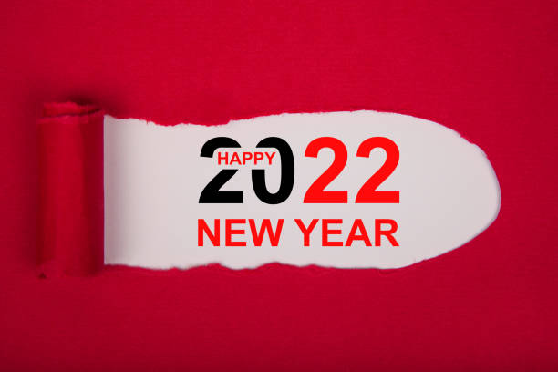 istock Torn Paper With Happy New Year 2022 On White Background 1357333138