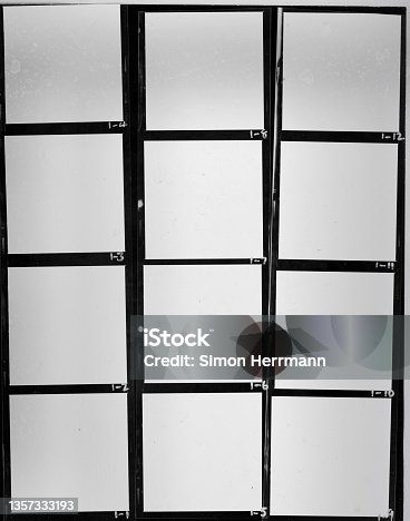 istock real flat bed scan of black and white hand copy contact sheet with 12 empty film frames 1357333193